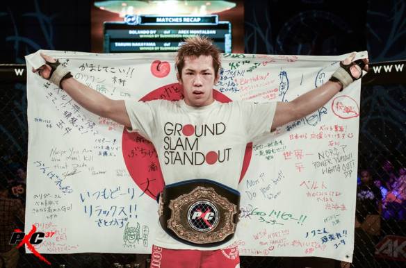 (PXC Champ Poses After His PXC 37 Win over Pitpitunge) Photo by PXC